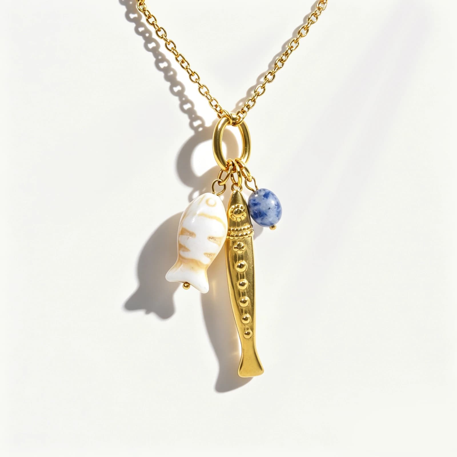 Fish and Sword Charm Necklace with lapis lazuli, gold-tone stainless steel